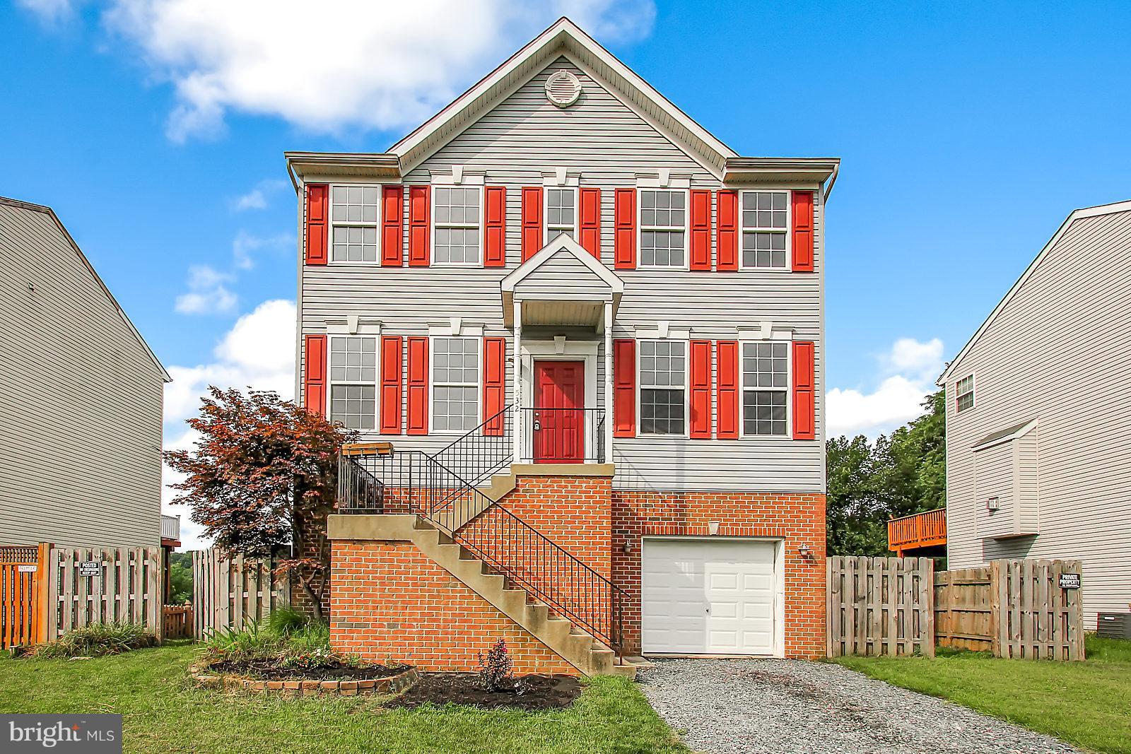 532 Grovethorn Road Baltimore, MD 21220 - Photo 2 of 30 a front view of a house with a yard