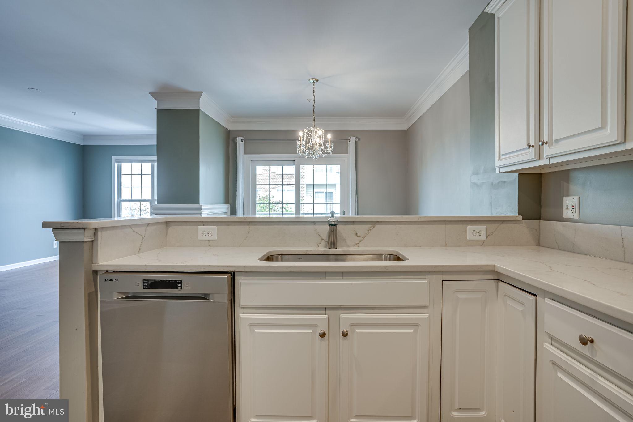 6321 Eagle Ridge Lane, Unit B Alexandria, VA 22312 - Photo 18 of 39 a kitchen with a sink stove and cabinets