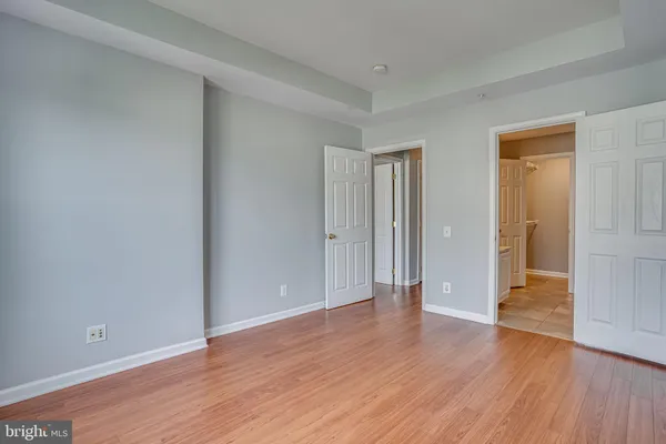 wooden floor & wooden door in an empty room