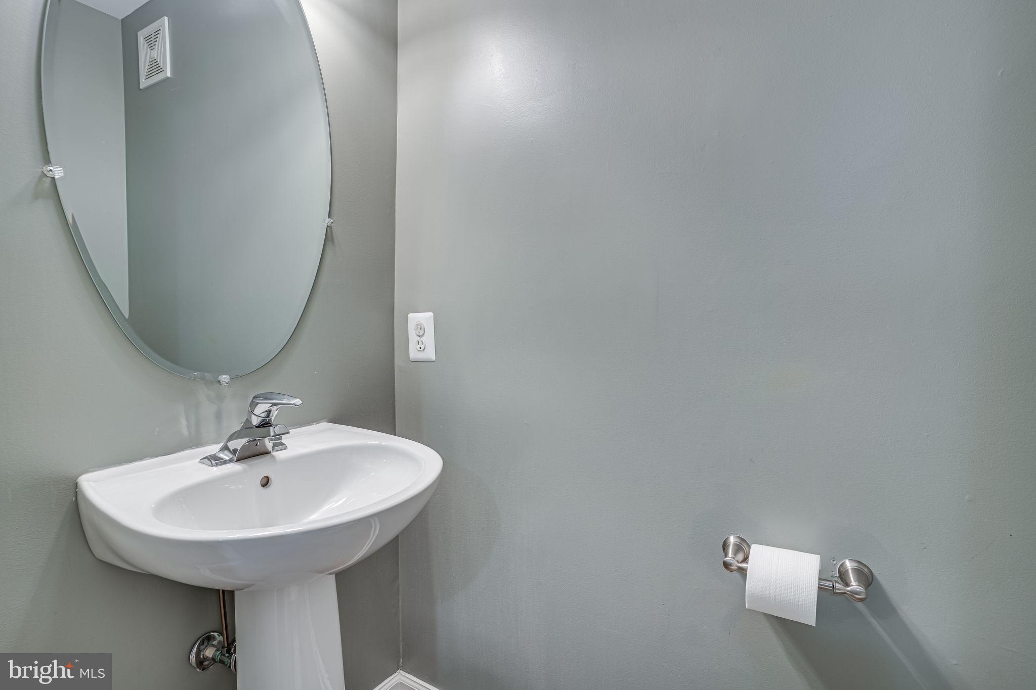 6321 Eagle Ridge Lane, Unit B Alexandria, VA 22312 - Photo 22 of 39 a bathroom with a sink and a mirror