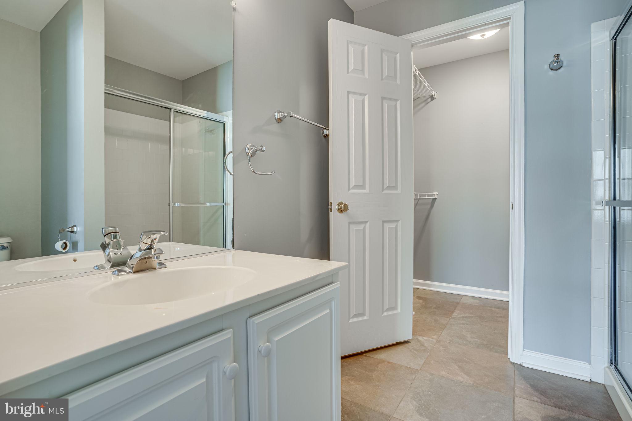 6321 Eagle Ridge Lane, Unit B Alexandria, VA 22312 - Photo 23 of 39 a bathroom with a sink vanity and a mirror