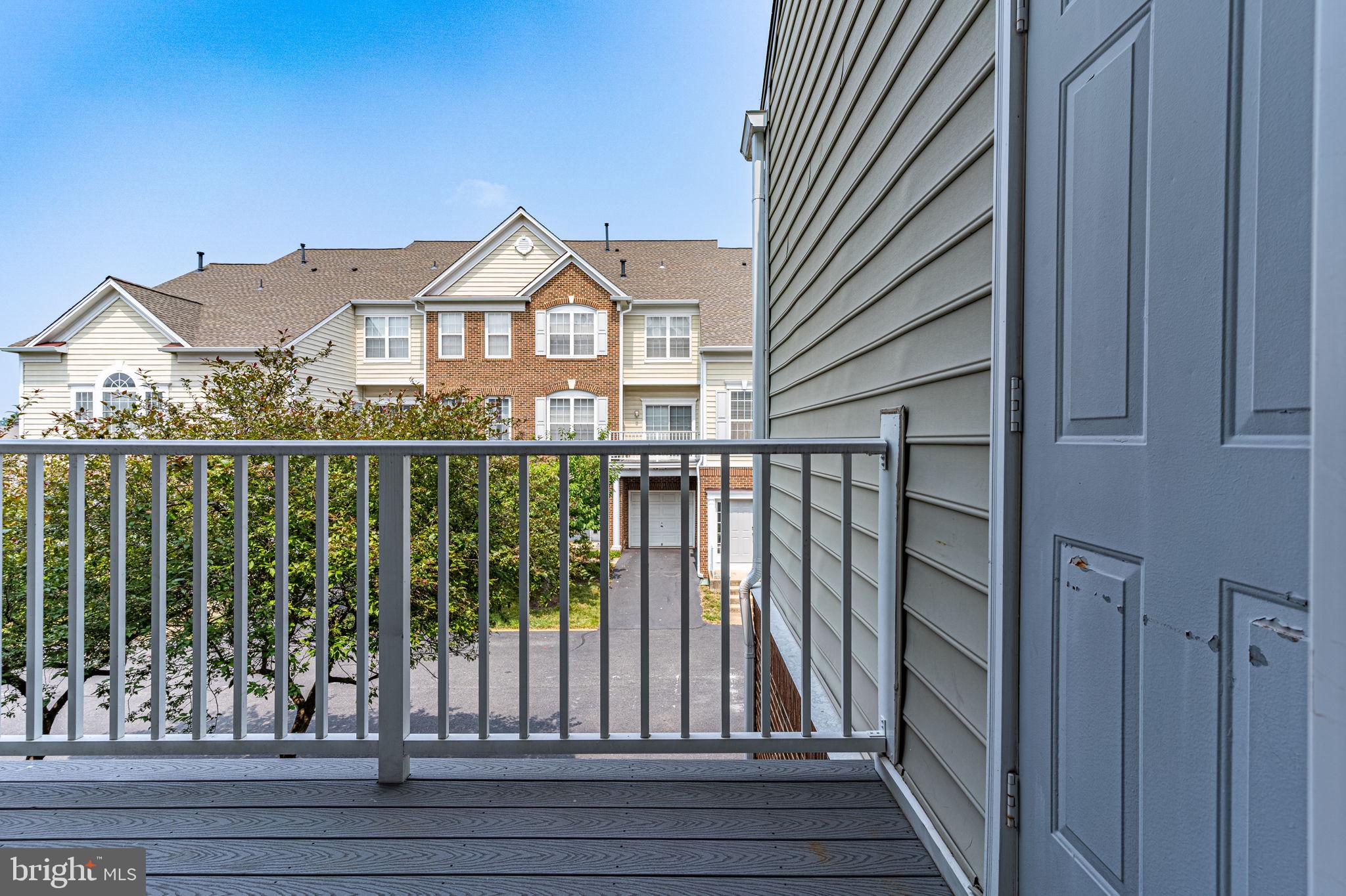 6321 Eagle Ridge Lane, Unit B Alexandria, VA 22312 - Photo 35 of 39 a view of a houses from a balcony