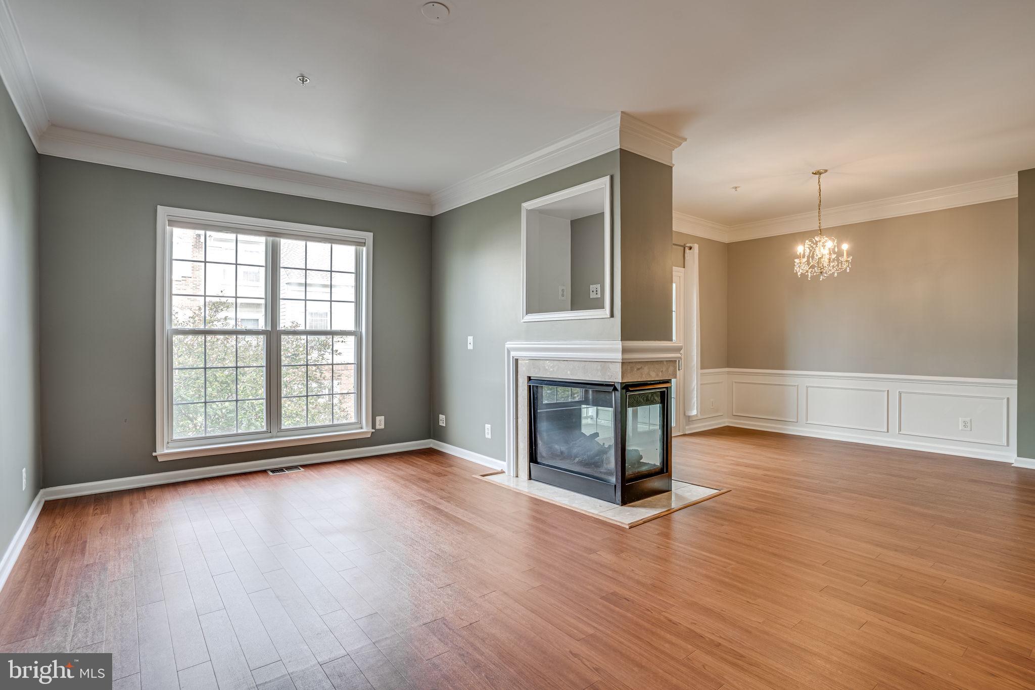 6321 Eagle Ridge Lane, Unit B Alexandria, VA 22312 - Photo 6 of 39 a view of a livingroom with wooden floor and a fireplace