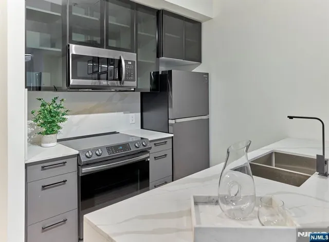 a kitchen with a stove and a microwave