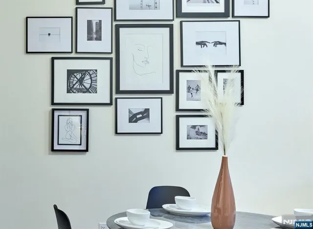 a view of a hallway with paintings on the wall