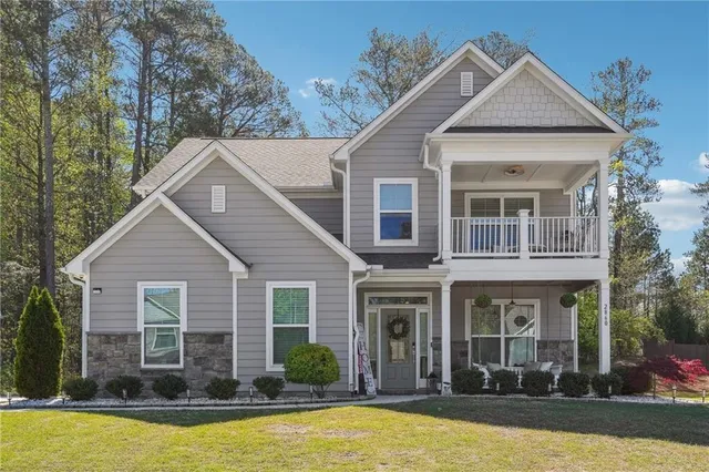 a view of a house with swimming pool and porch