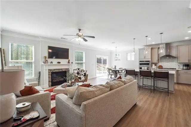 a living room with furniture and a fireplace
