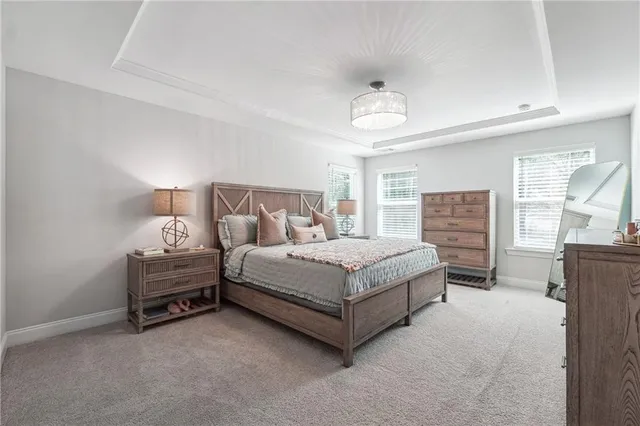 a bedroom with a bed and a table