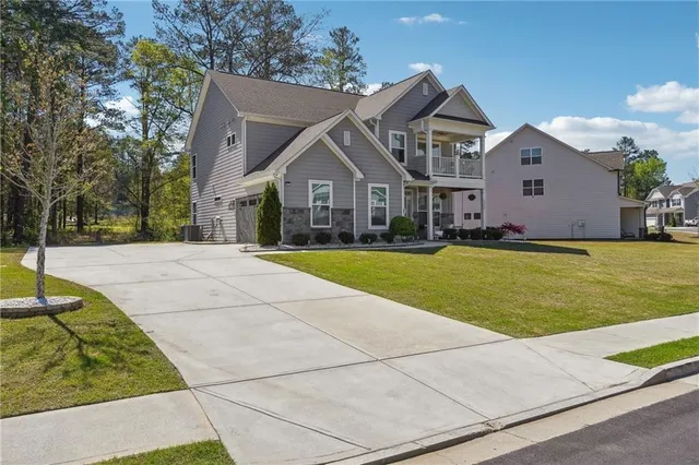 a front view of house with yard and green space