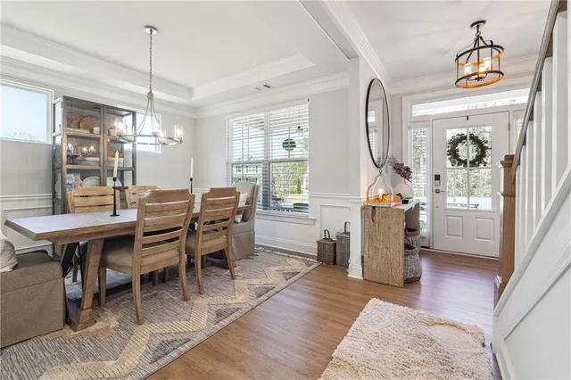 a dining room with furniture and window