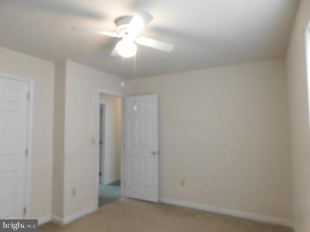 5013 Decatur Street St. Leonard, MD 20685 - Photo 32 of 45 an empty room with a chandelier fan