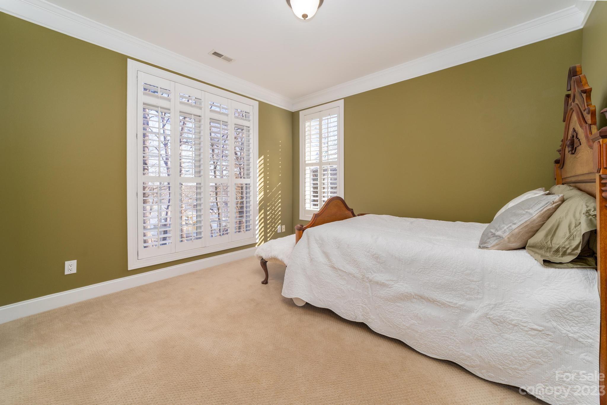 8065 Bay Pointe Drive Denver, NC 28037 - Photo 18 of 40 a spacious bedroom with a bed and a window