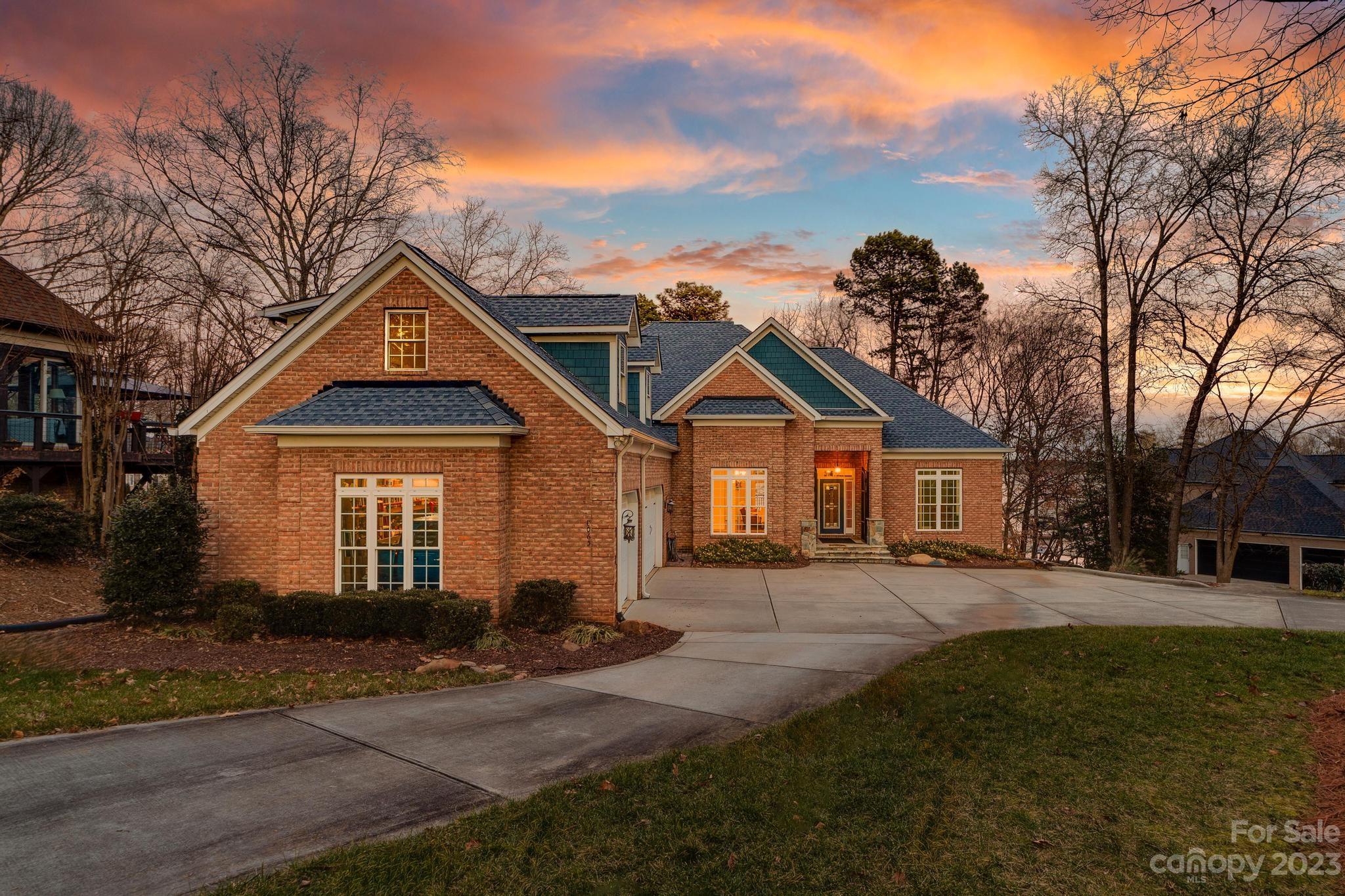 8065 Bay Pointe Drive Denver, NC 28037 - Photo 2 of 40 a front view of a house with a yard and garage