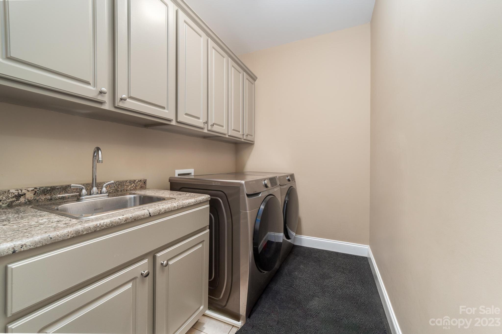 8065 Bay Pointe Drive Denver, NC 28037 - Photo 21 of 40 a utility room with dryer and washer