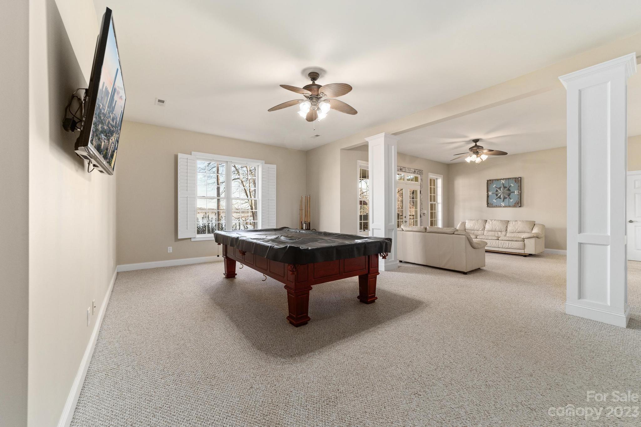 8065 Bay Pointe Drive Denver, NC 28037 - Photo 24 of 40 a living room with furniture and a flat screen tv