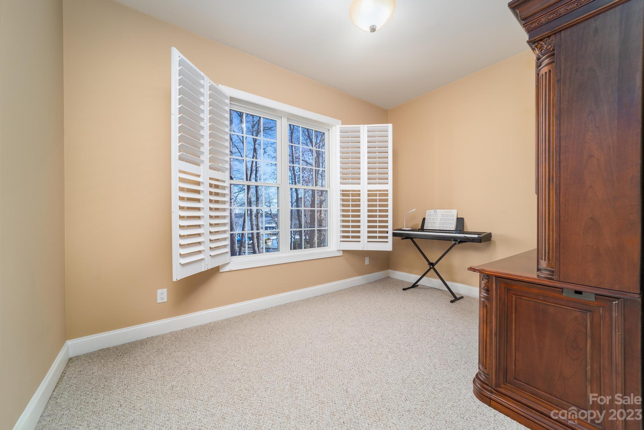 8065 Bay Pointe Drive Denver, NC 28037 - Photo 29 of 40 a living room with furniture and a window