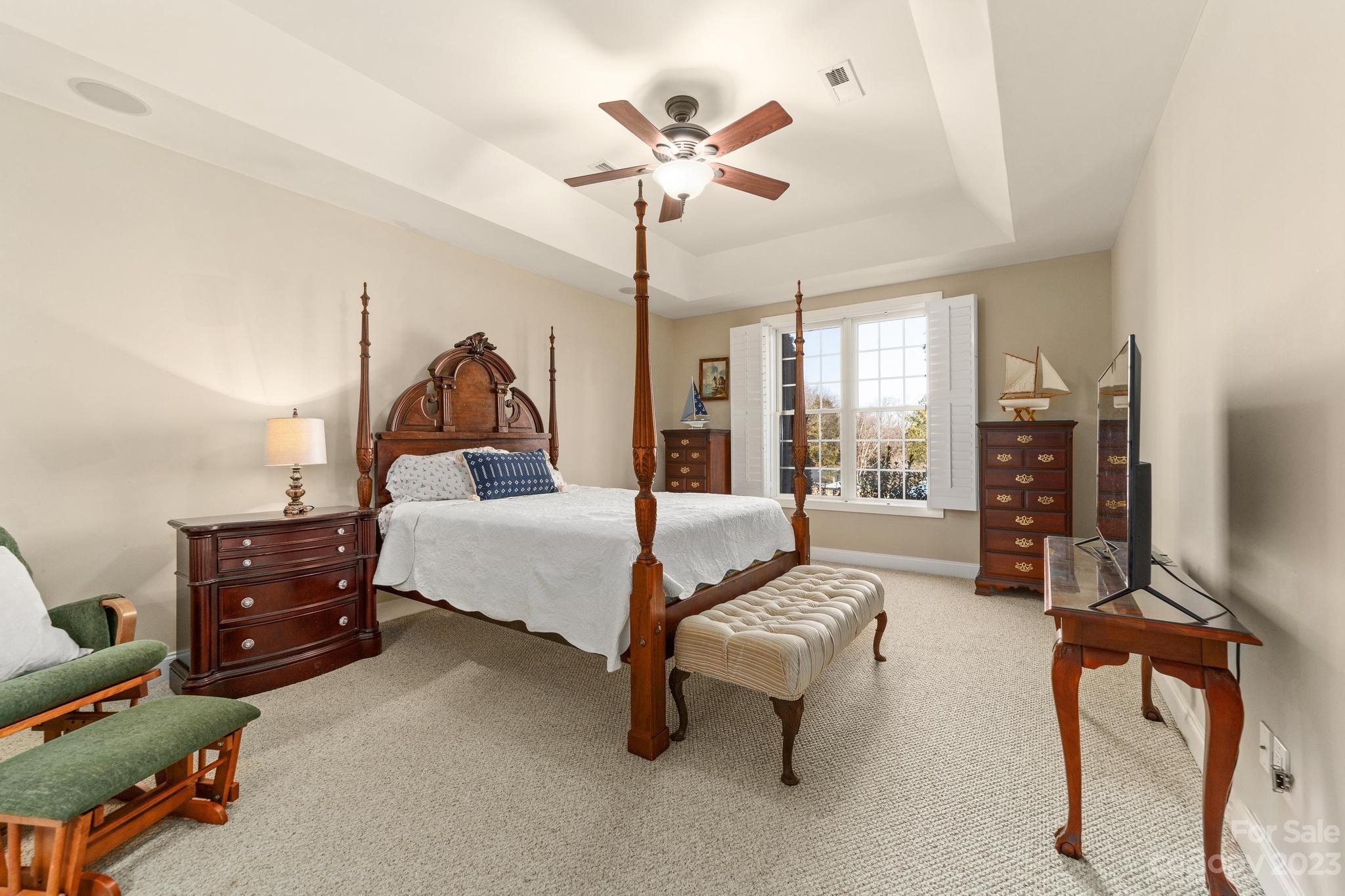 8065 Bay Pointe Drive Denver, NC 28037 - Photo 31 of 40 a living room with furniture and chandelier