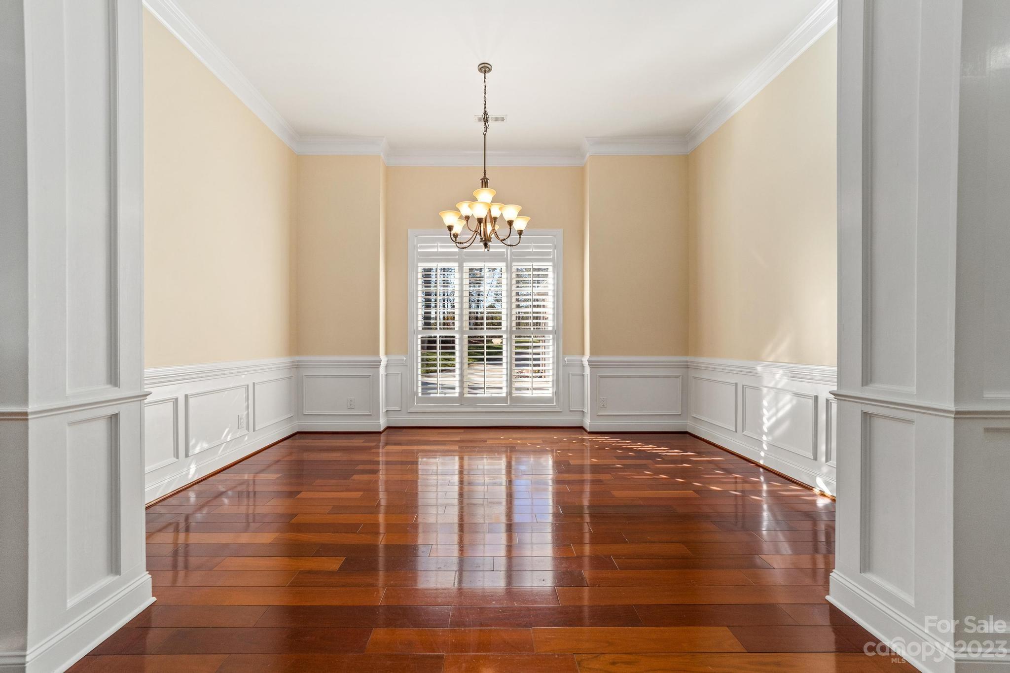 8065 Bay Pointe Drive Denver, NC 28037 - Photo 8 of 40 a view of an empty room with window and wooden floor