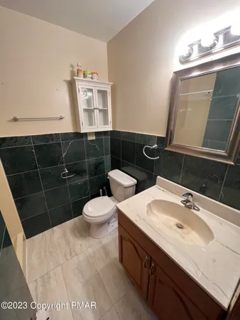 a kitchen with refrigerator and microwave