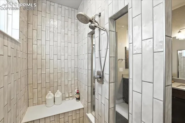 a bathroom with a sink and shower