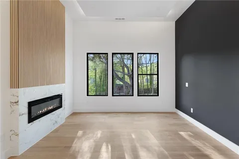 a view of an empty room with a window