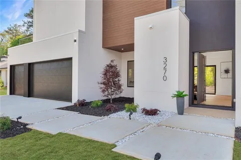 a front view of a house with yard