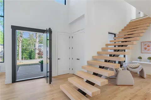 a view of work space with furniture and stairs