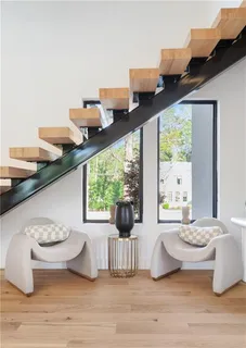 a white bath tub sitting next to a toilet