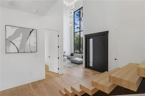 a view of a bedroom with furniture and front door
