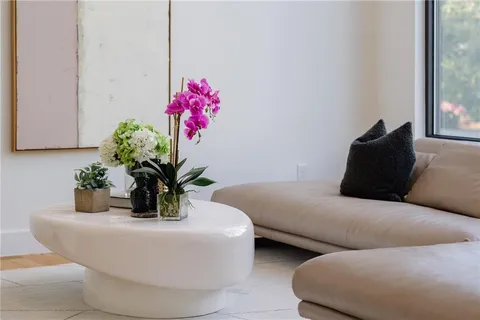 a white bath tub sitting in a bedroom