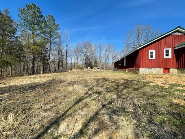 598 Sand Ridge Road Lexington, TN 38351 - Photo 4 of 18 a backyard of a house with large trees