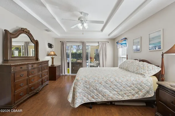 a bedroom with a large bed and a dresser