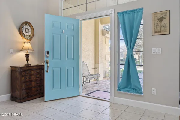 a view of a hallway with entryway front door
