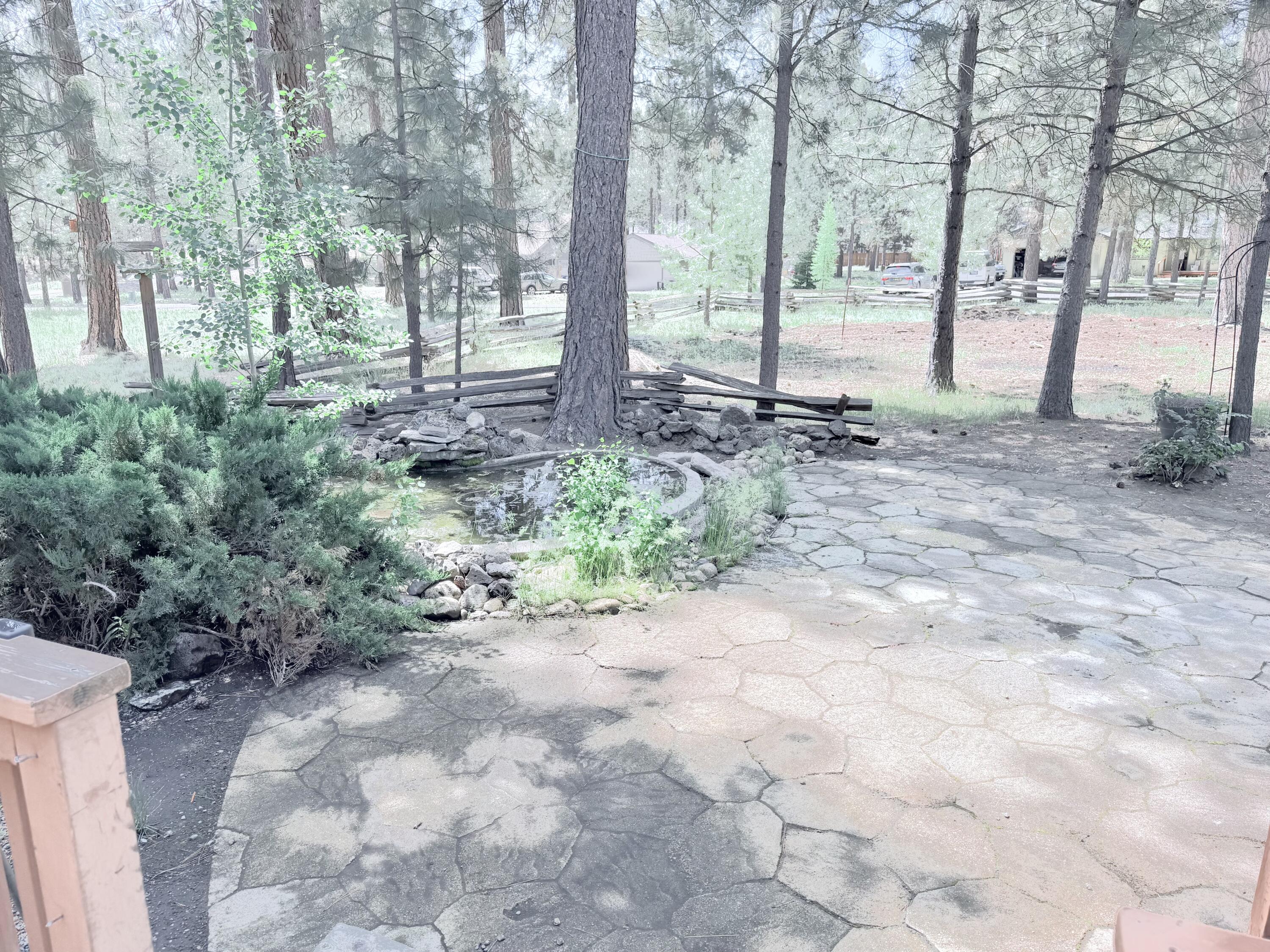 68964 Graham Court Sisters, OR 97759 - Photo 4 of 28 a view of a backyard with garden