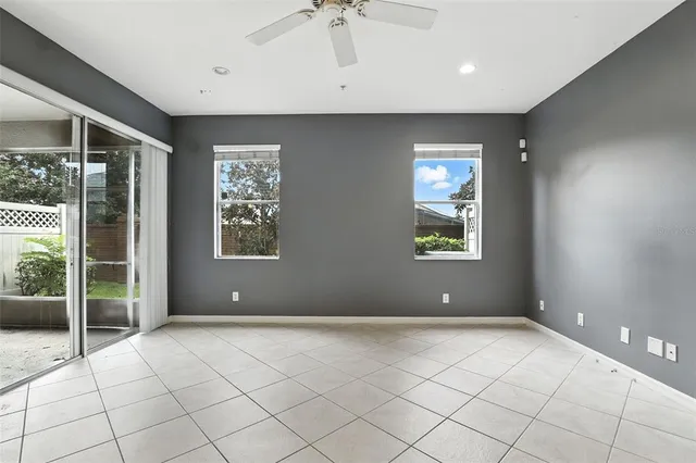 a view of an empty room with glass door
