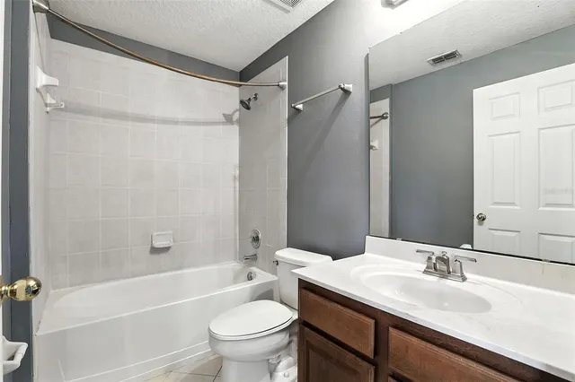 a bathroom with a sink a toilet and a bathtub