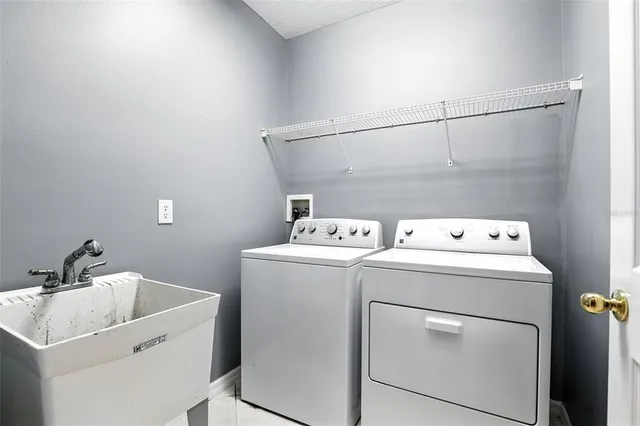 a utility room with dryer and washer