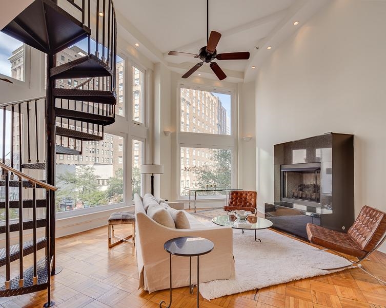 97 Monroe Avenue Memphis, TN 38103 - Photo 12 of 25 a living room with furniture and a large window