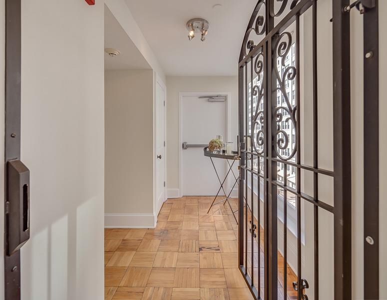 97 Monroe Avenue Memphis, TN 38103 - Photo 2 of 25 a view of a hallway with wooden floor and staircase