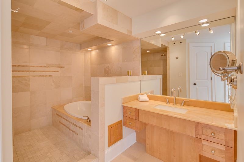 97 Monroe Avenue Memphis, TN 38103 - Photo 21 of 25 a bathroom with a tub sink and mirror