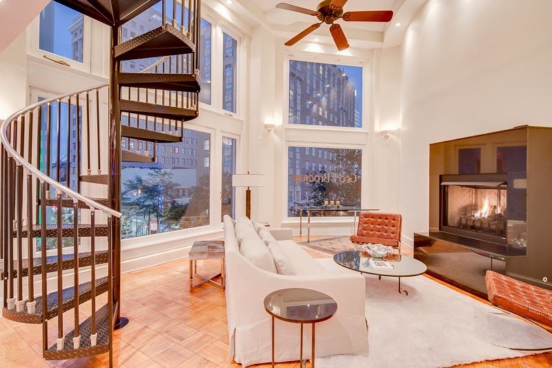 97 Monroe Avenue Memphis, TN 38103 - Photo 25 of 25 a living room with furniture a fireplace and a flat screen tv