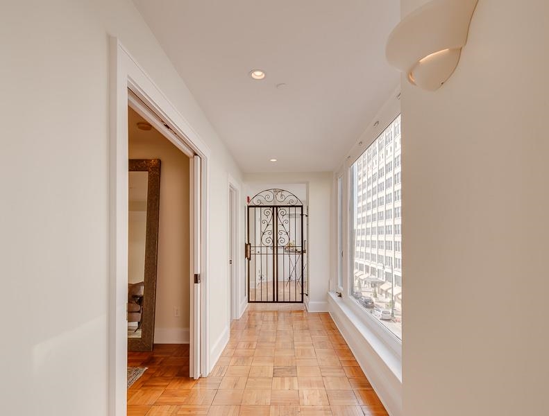 97 Monroe Avenue Memphis, TN 38103 - Photo 5 of 25 a view of hallway with windows and chandelier