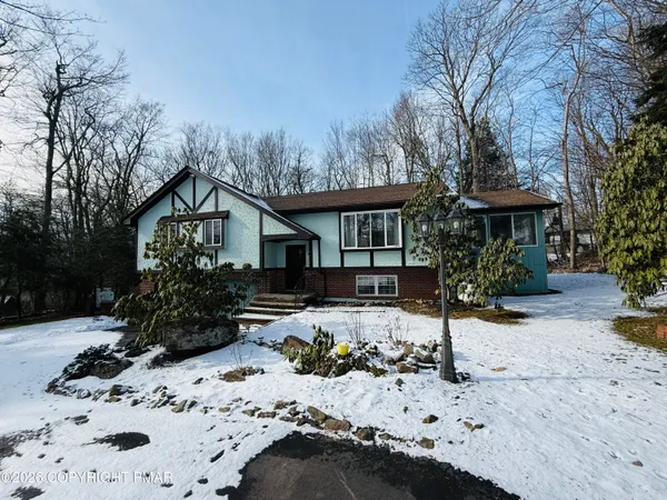 a view of a house covered in snow