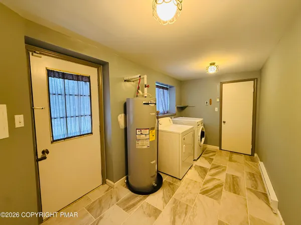 a view of a storage & utility room with a sink