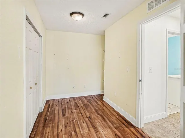 a utility room with cabinets dryer and washer