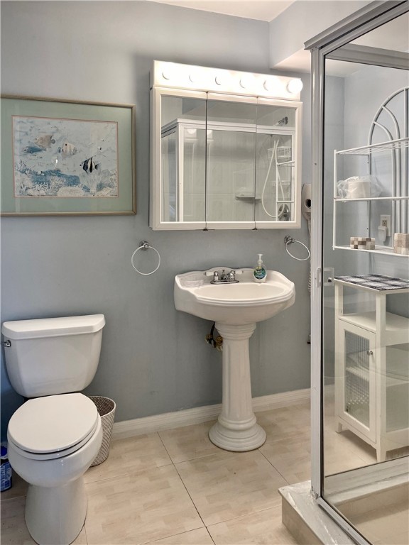 5400 A1a Highway, Unit A2 Vero Beach, FL 32963 - Photo 19 of 28 a bathroom with a toilet sink and mirror