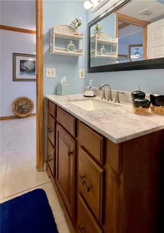 a bathroom with double vanity sink and mirror