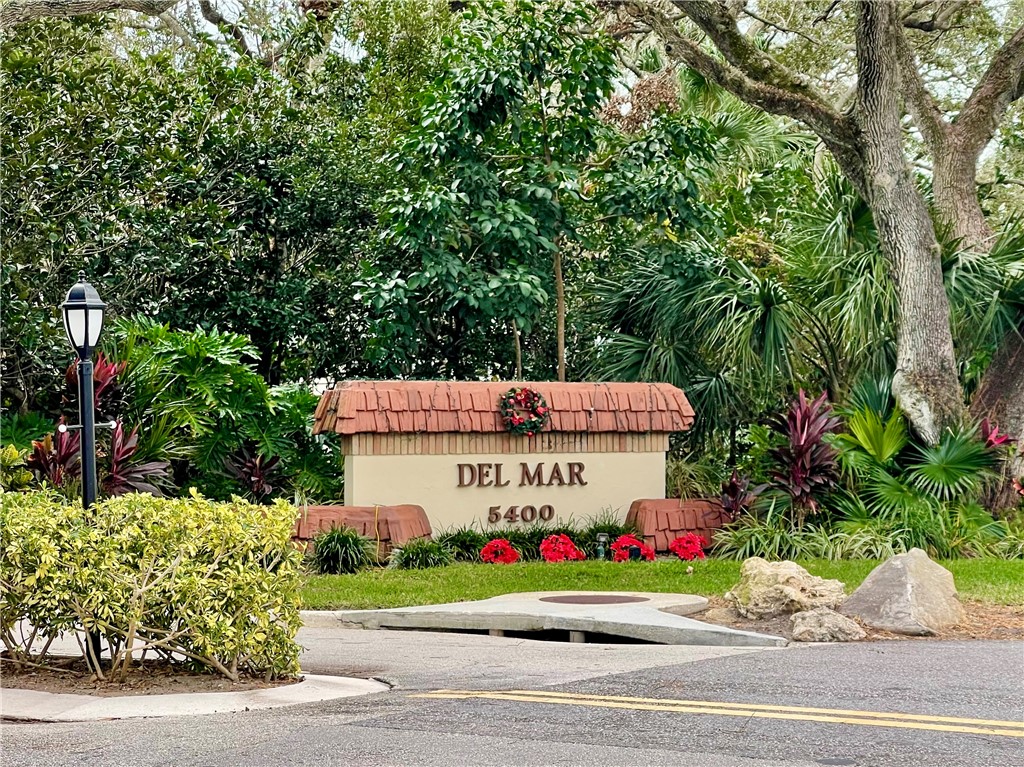 5400 A1a Highway, Unit A2 Vero Beach, FL 32963 - Photo 28 of 28 a sign board with buildings in the background