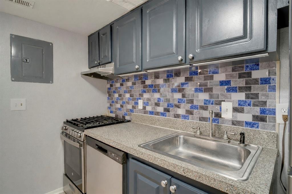 129 Blue Pointe Way, Unit 340 Altamonte Springs, FL 32701 - Photo 9 of 25 a kitchen with a sink and cabinets