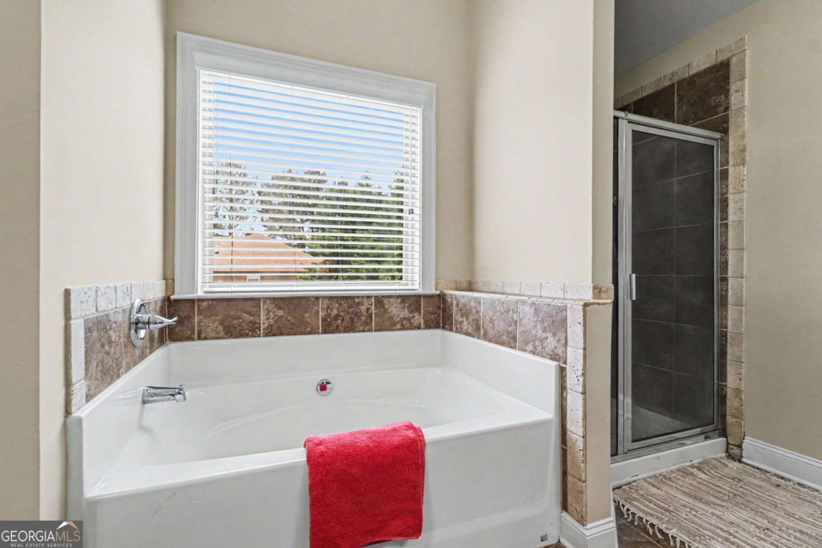 207 George Wynn Road Palmetto, GA 30268 - Photo 30 of 32 a white bath tub sitting next to a window